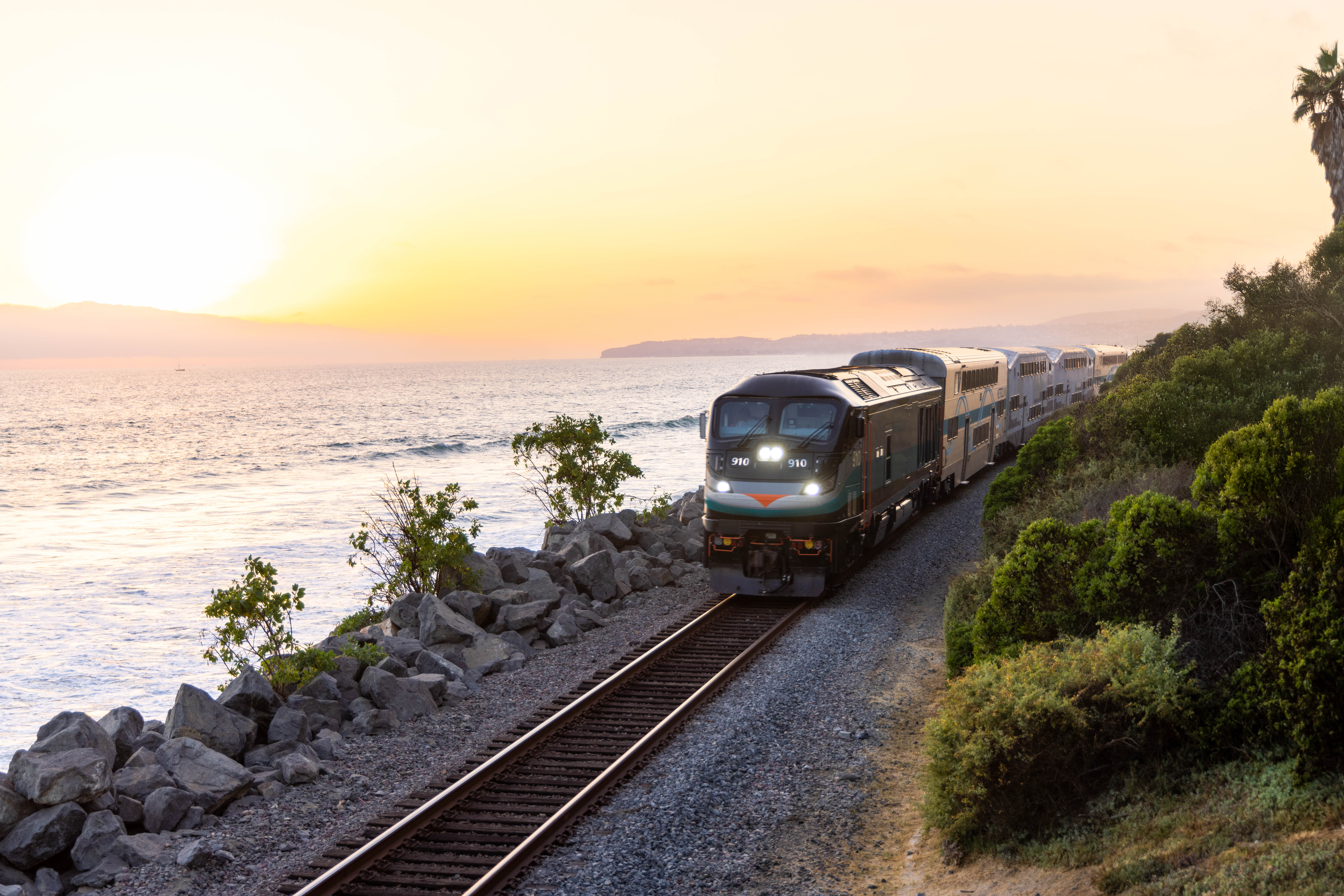 A Metrolink train on the OC Line travels near San Clemente at sunset in this undated promotional image by Metrolink.