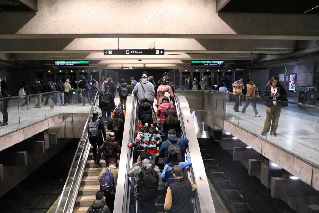 Passengers ascend the stairs at a BART station in this promotional image from the transit agency.