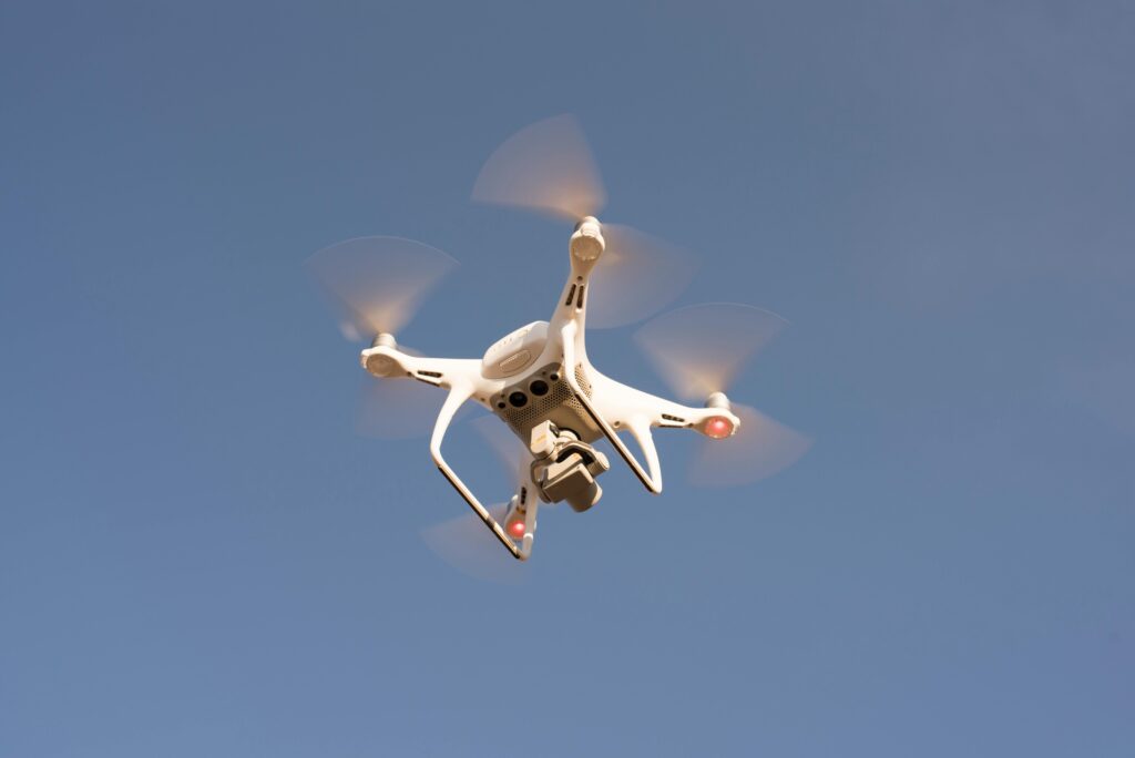 Low Angle Shot of Drone and drones Flying in the Sky.