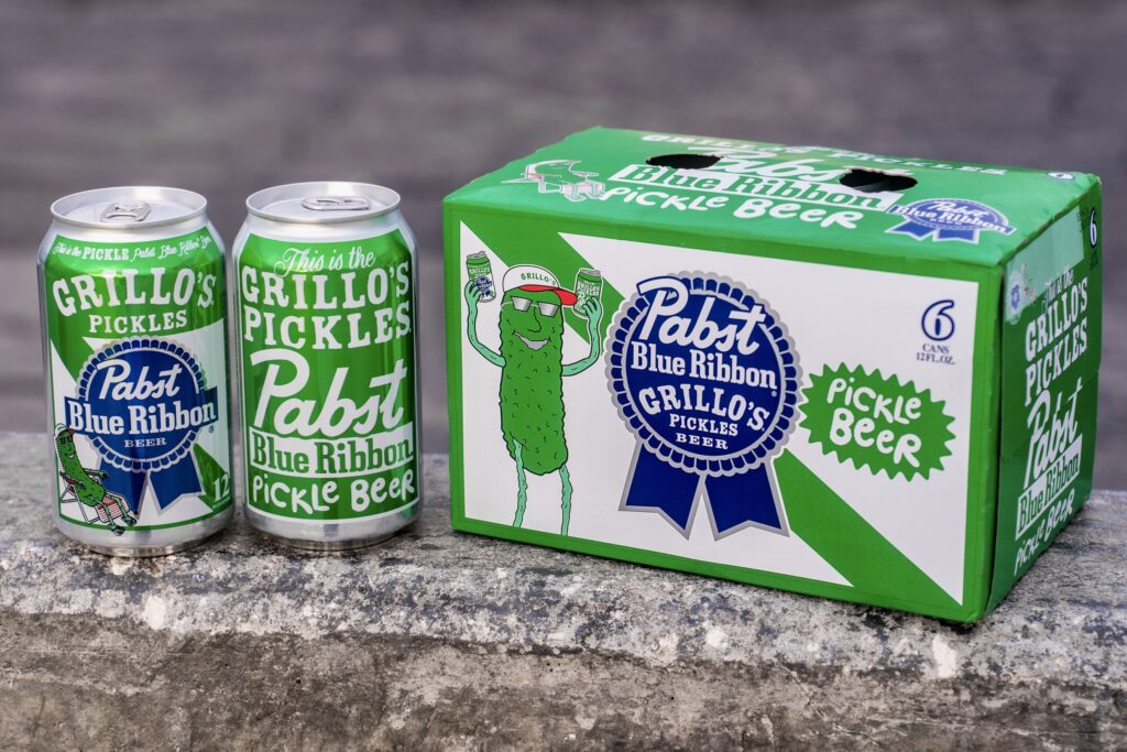 Green cans and a box of Pabst Blue Ribbon and Grillo's Pickle Beer is shown in this promotional image