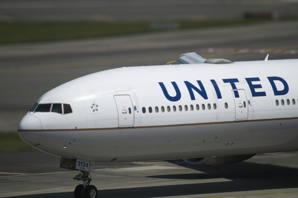 A United Airlines plane taxis on the runway