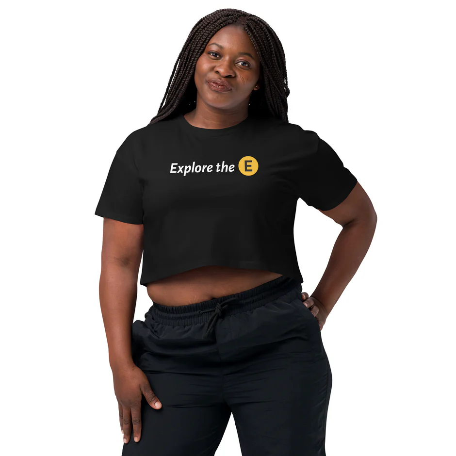 A woman wears a black t-shirt that reads "K is the Culture"