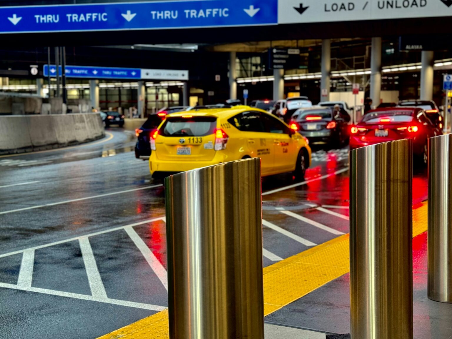 Taxis and rental cars are seen outside Seattle-Tacoma International Airport in this undated image from Unsplash.com; Airbnb is adding new airport pickup and rental car functions