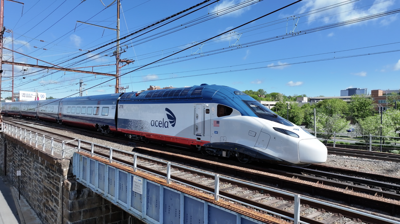 Exterior image of an Amtrak NextGen Acela train operating in the Northeast Corridor. (Amtrak)