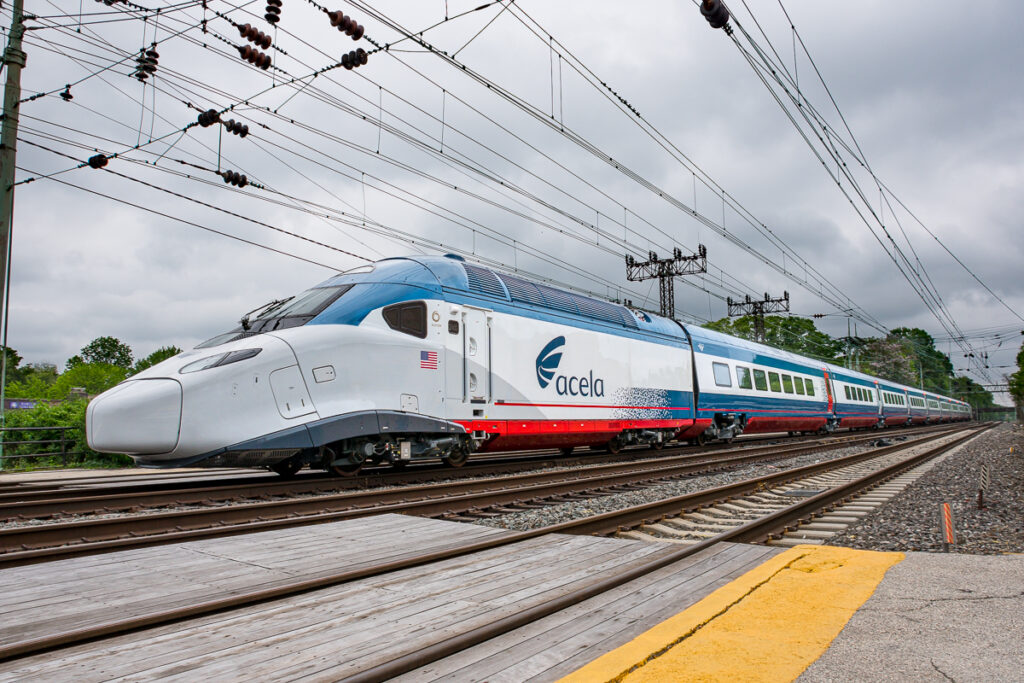 Exterior image of an Amtrak NextGen Acela train operating in the Northeast Corridor. (Amtrak)