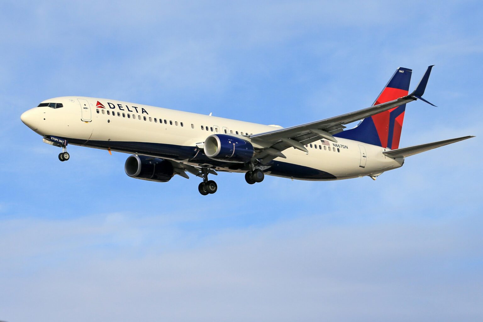 A Delta Air Lines plane is seen flying in the sky in this undated image. (Photos courtesy Pexels.com)