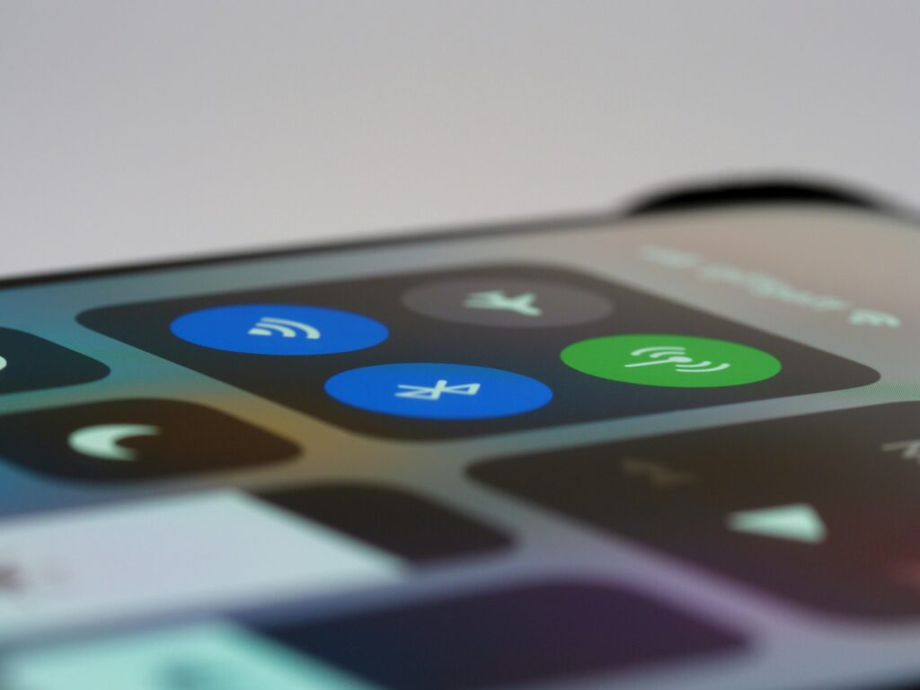 An iPhone screen with the Wi-Fi, bluetooth and cellular settings turned on.