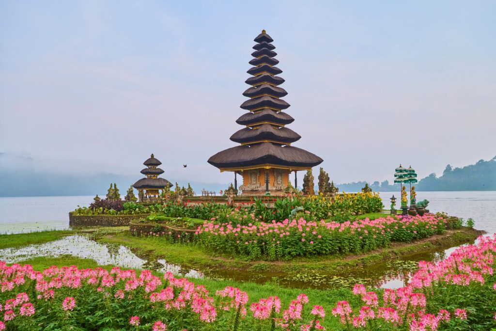 Ulun Danu Beratan Temple in Bali, surrounded by colorful flowers is seen this 2024 photo from Pexels.com