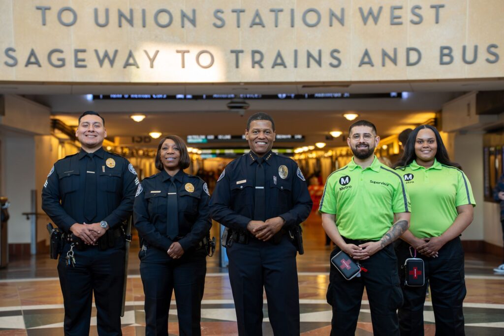 LA Metro Department of Public Safety Chief Bill Scott stands alongside members of his staff at Los Angeles Union Station in a promotional photo for the transit agency's hiring efforts. (LA Metro)