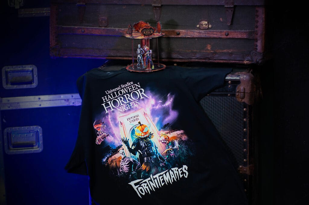 This promotional image shows a t-shirt and an acrylic figure inspired by the Fortnitemares event taking place at Universal Studios theme parks as part of the 2026 Halloween Horror Nights. (Courtesy: Universal)