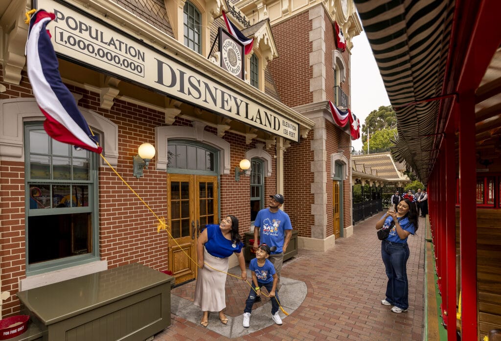 Disneyland Resort Celebrates Historic Milestone – One Billionth Guest: A milestone at Disneyland Resort in Anaheim, Calif., on Friday, July 3, 2026; The Happiest Place on Earth commemorates welcoming one billion guests to Disneyland park and Disney California Adventure park. The honorary one billionth guest, Andres Robles, 8, of Arizona and his parents joined with the Disney Ambassadors to unveil updated sign that reads “Population 1,000,000,000”. (ChristianThompson/Disneyland Resort)