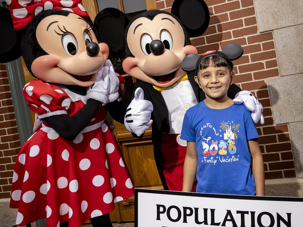 Disneyland celebrates arrival of 1 billionth theme park guest A milestone as Disneyland Resort commemorates welcoming one billion guests to Disneyland park and Disney California Adventure park in Anaheim, Calif., on Friday, July 3, 2026;. The honorary one billionth guest, Andres Robles, 8, of Arizona and his parents joined with the Disney Ambassadors to unveil updated sign that reads “Population 1,000,000,000”. (Christian Thompson/Disneyland Resort)