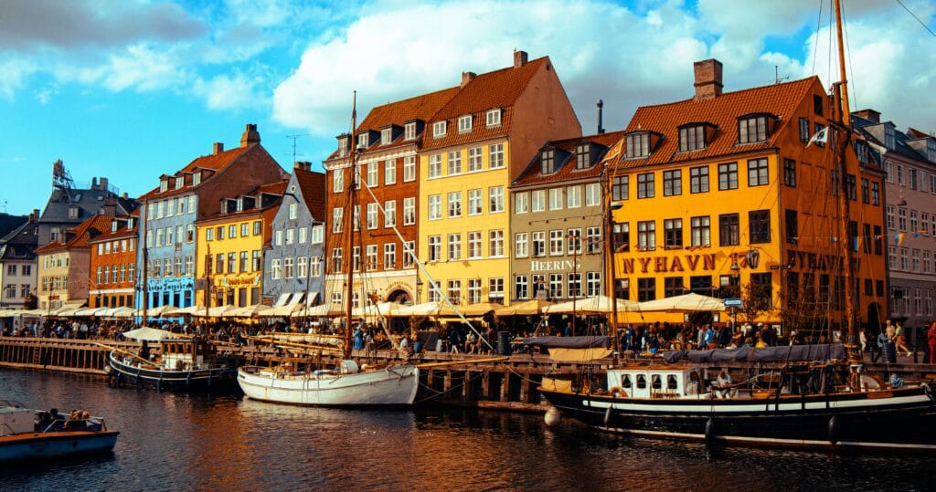 The Nyhavn district in Copenhagen, Denmark, is seen in this 2025 photo shared to Unsplash.com; Copenhagen is one of the top European fall vacations for 2026.