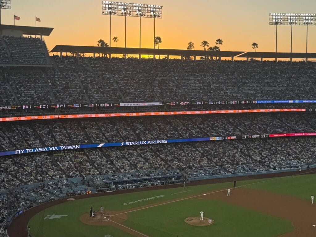 The sun sets behind the third-baseline reserve level seats at Dodger Stadium on Aug. 1, 2026. (www.rabblenews.com)