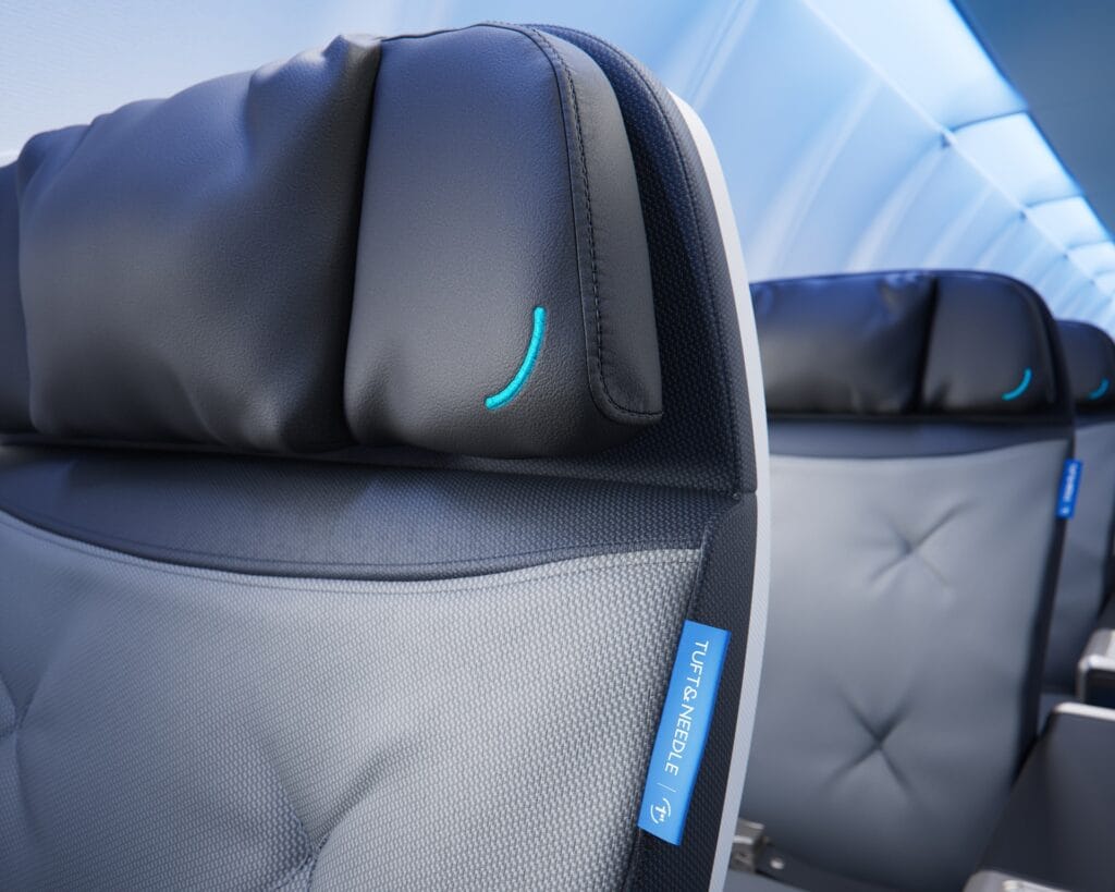 This promotional image from JetBlue shows the custom padded headrests on the newly designed seats in the BlueFirst section.