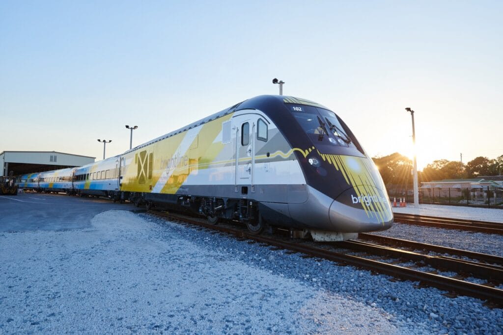 A blue Brightline Florida train departs a station in this undated promotional image from Brightline.