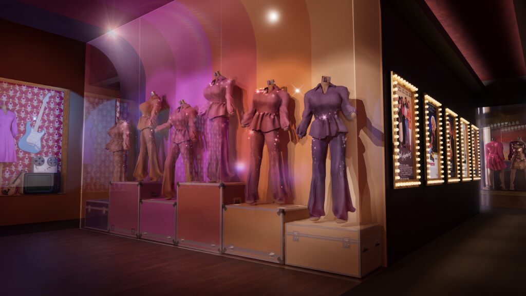 Outfits worn by Dolly Parton line a wall at the Dolly Life of Many Colors museum in Nashville, Tennessee, in this promotional image.
